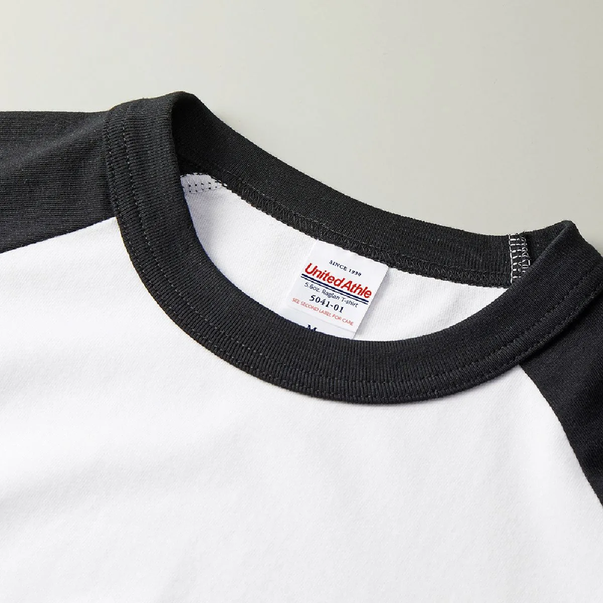 5041-01 Retro 5.6oz Raglan Sleeve T-Shirt 10 The neck rib is a two -handed binder neck.