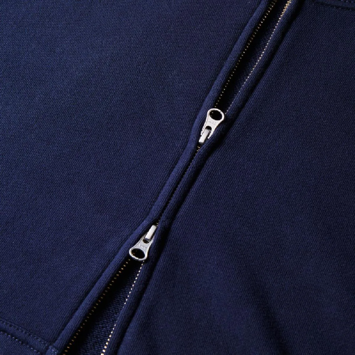 The zipper is hidden, the double slider specification made by YKK, the puller is the DALH type
