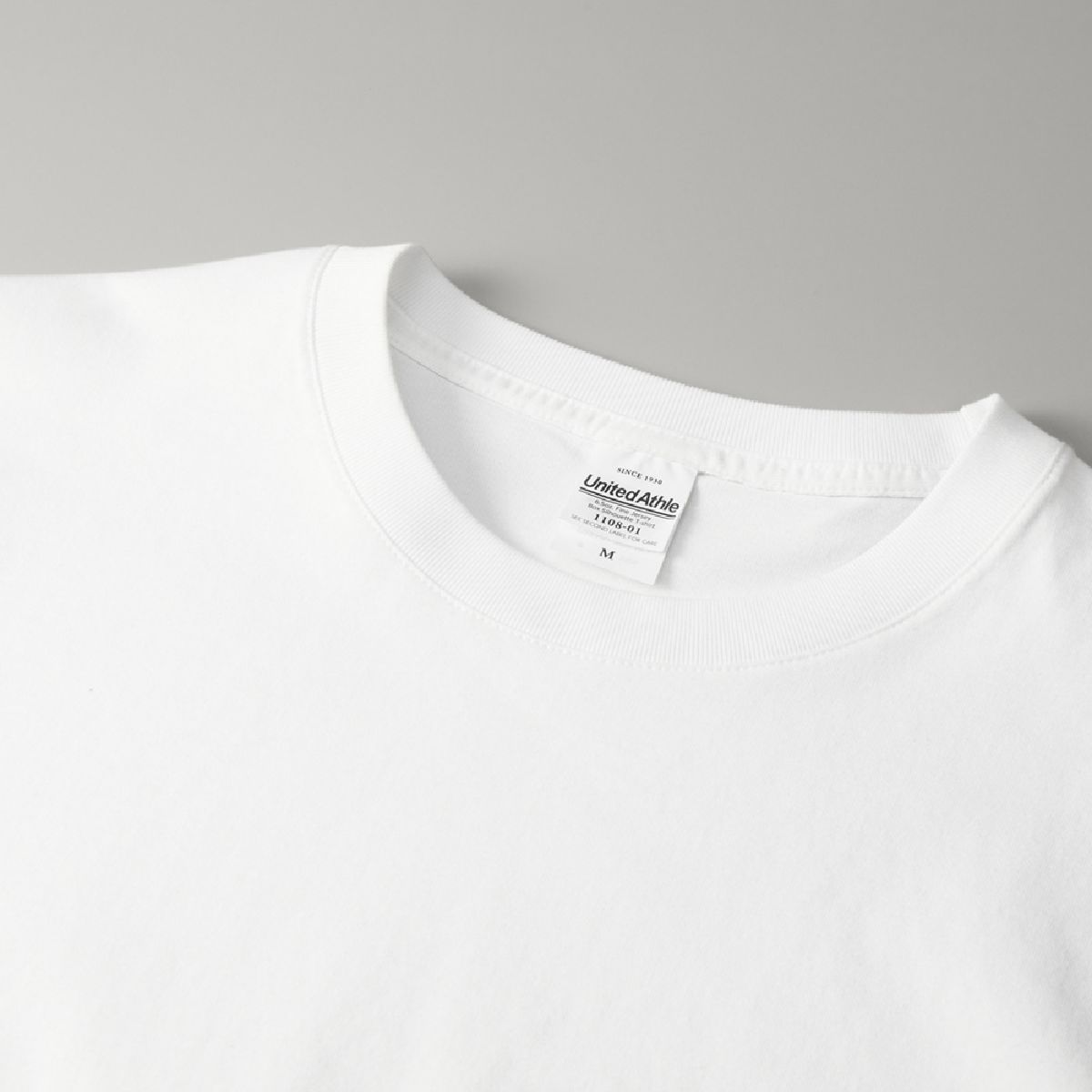 The neckline is finished with edge stitching for added durability.