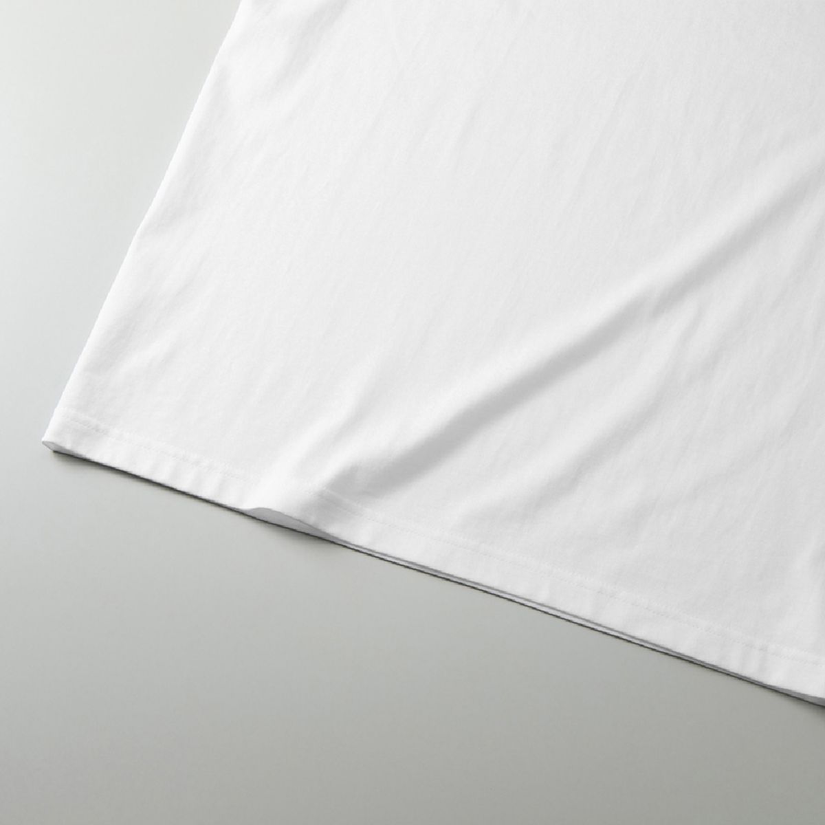 The hem is finished with a double needle stitch.