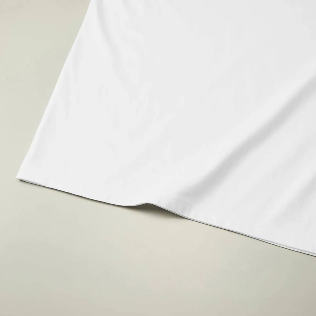 The hem is finished with a double needle stitch.