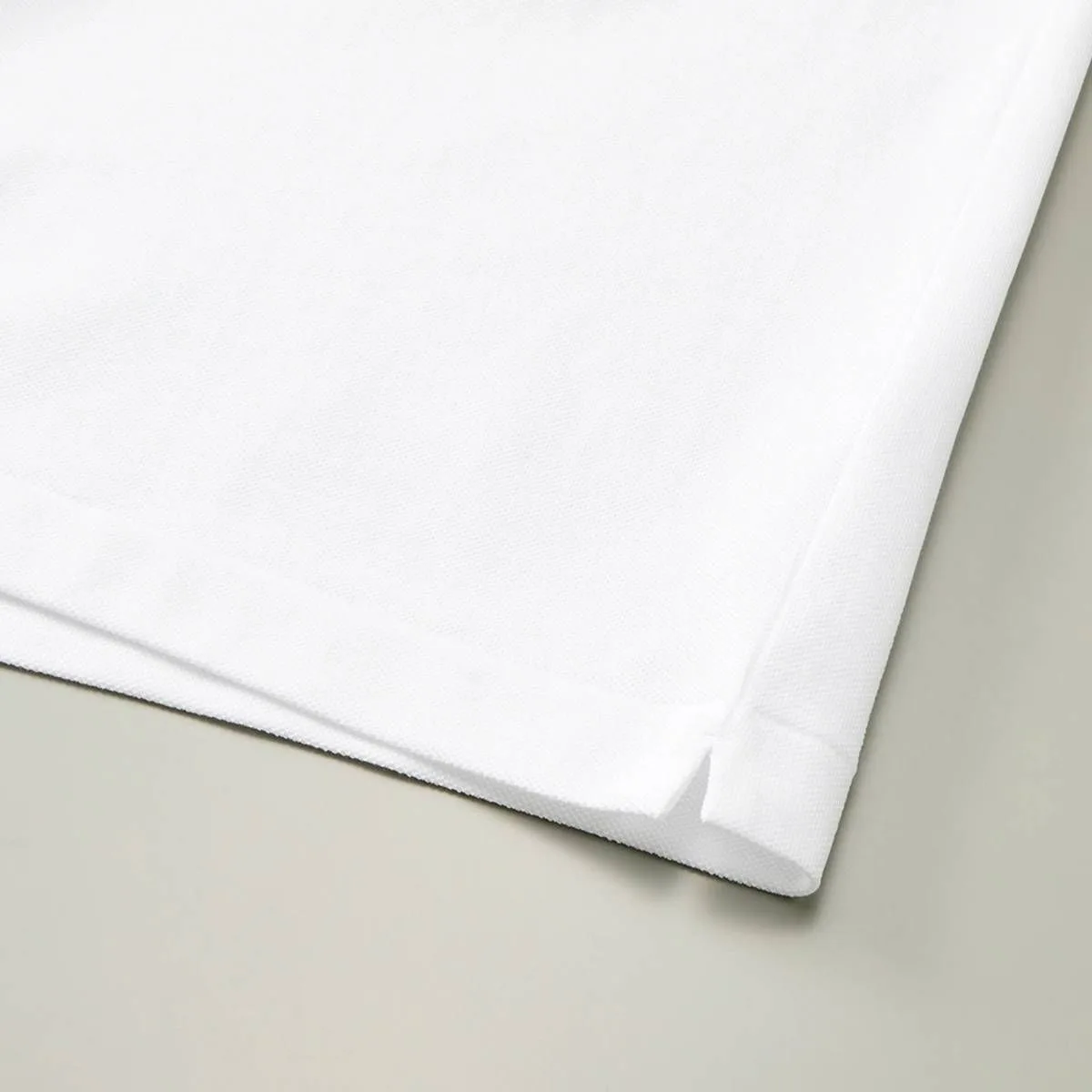 There are slits on both sides of the hem.