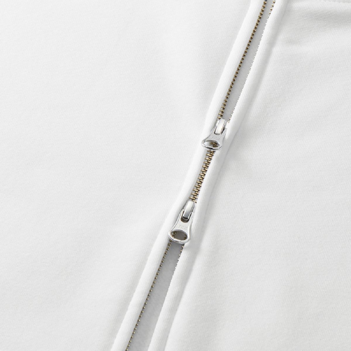 The zipper is concealed and features a YKK DALH type double slider.