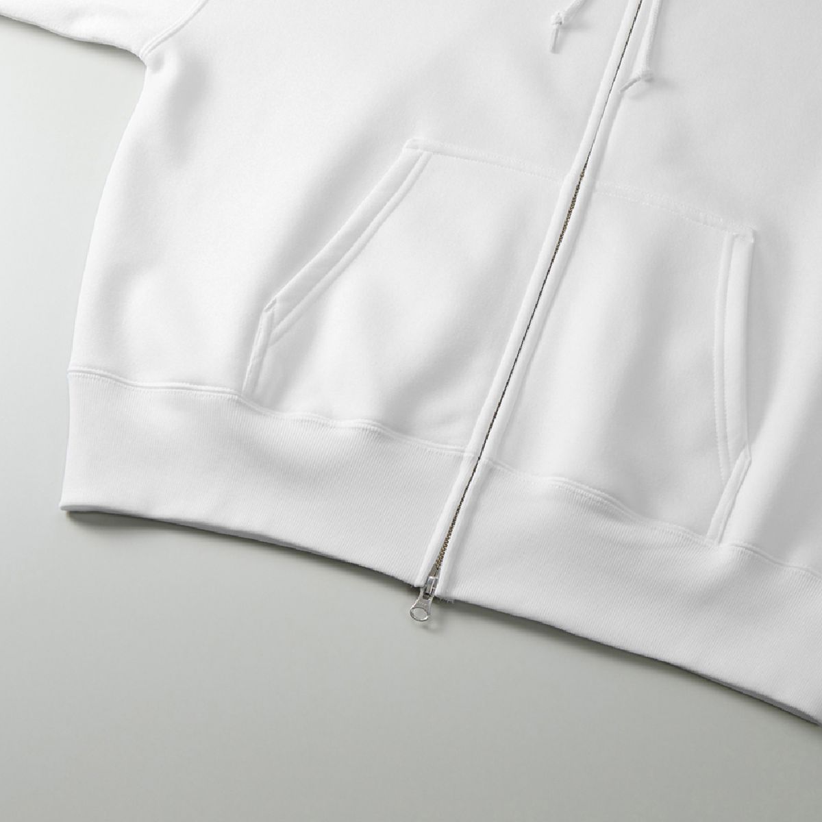 Features a kangaroo pocket and ribbed cuffs.