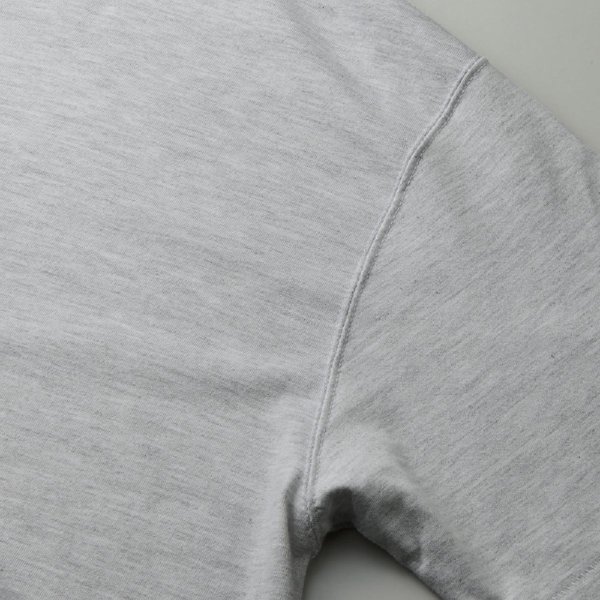 The armholes are finished with a sturdy double-needle stitch.