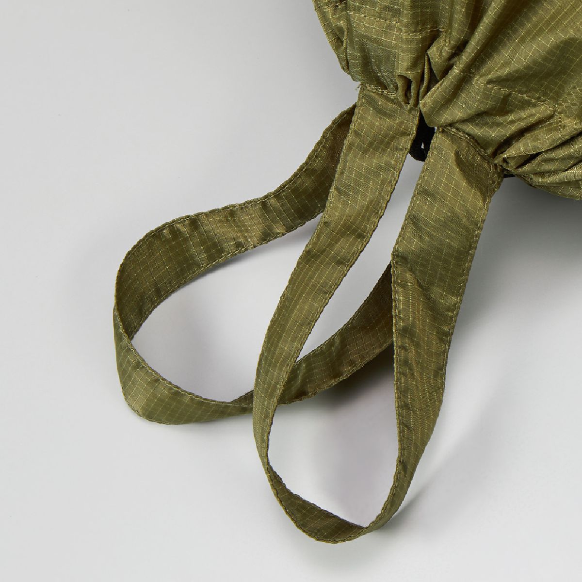 With a handle on the bag