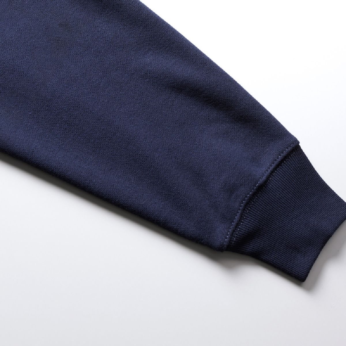 The cuffs are ribbed, and the seams are finished with durable double-needle stitching.