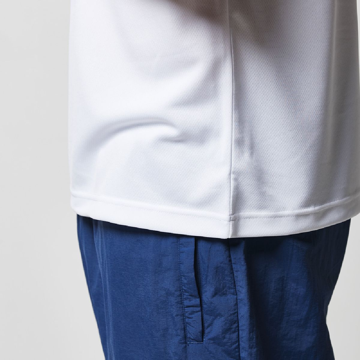 Side seam construction, double-needle stitching at the hem.