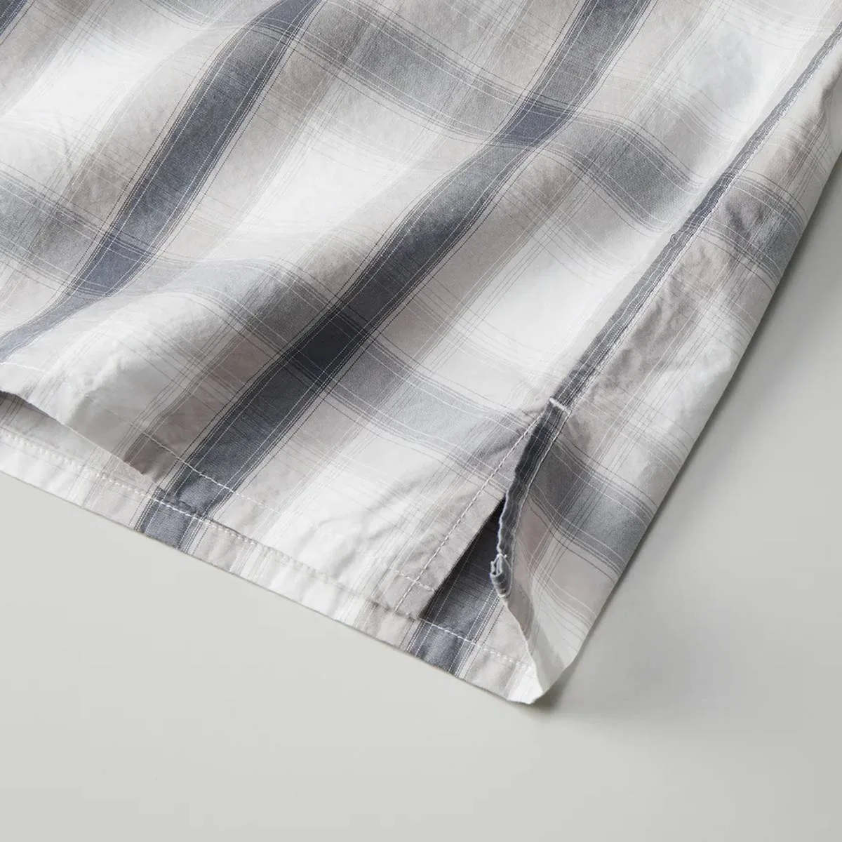 There are slits on both sides of the hem.