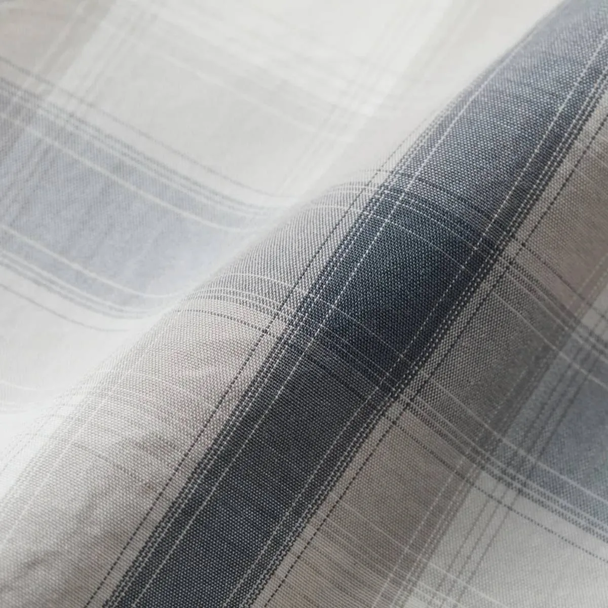 The garment washing process moderately reduces the stiffness and adds a soft texture to the fabric.