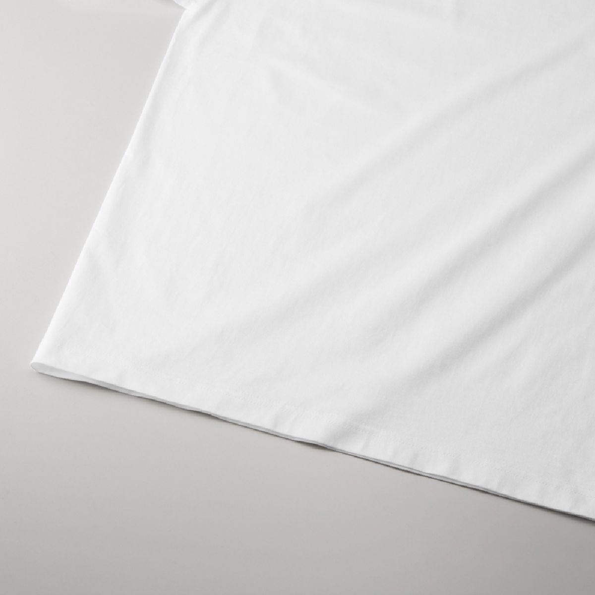 The hem is finished with a double needle stitch.