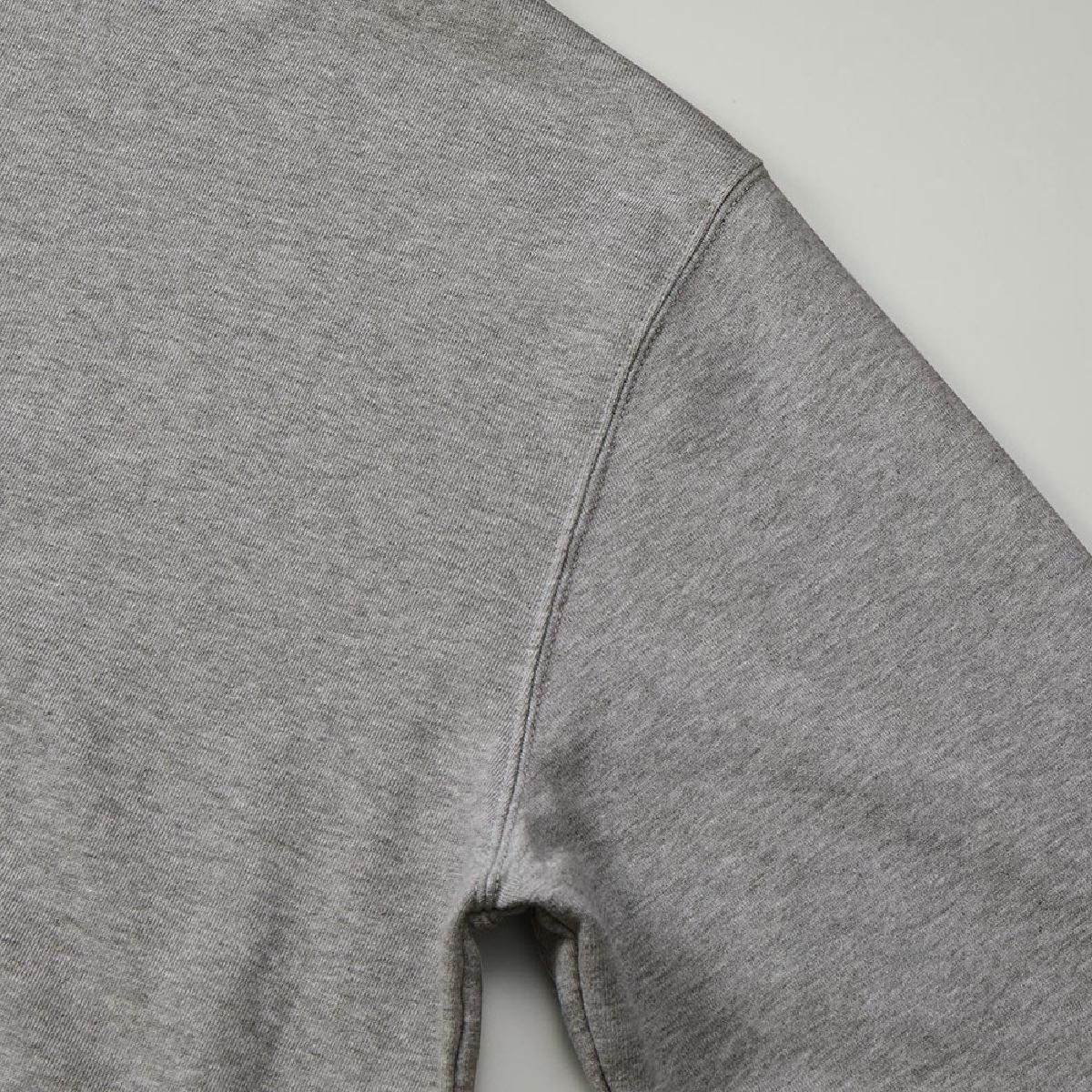 The armholes are finished with a sturdy double-needle stitching.