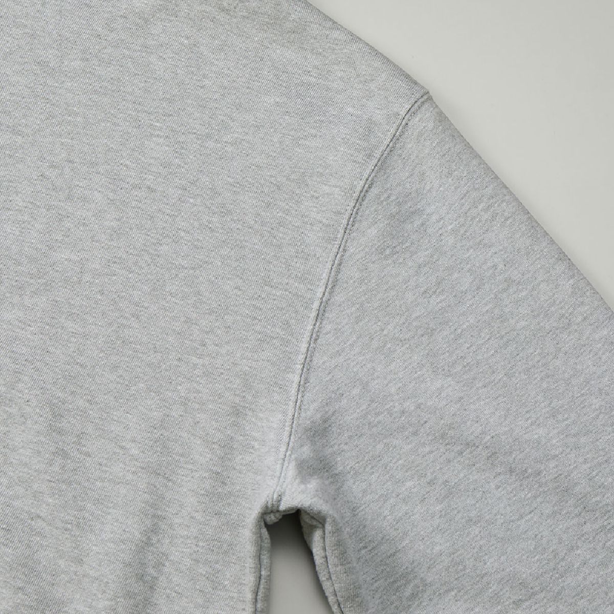 The armholes are finished with a sturdy double-needle stitching.