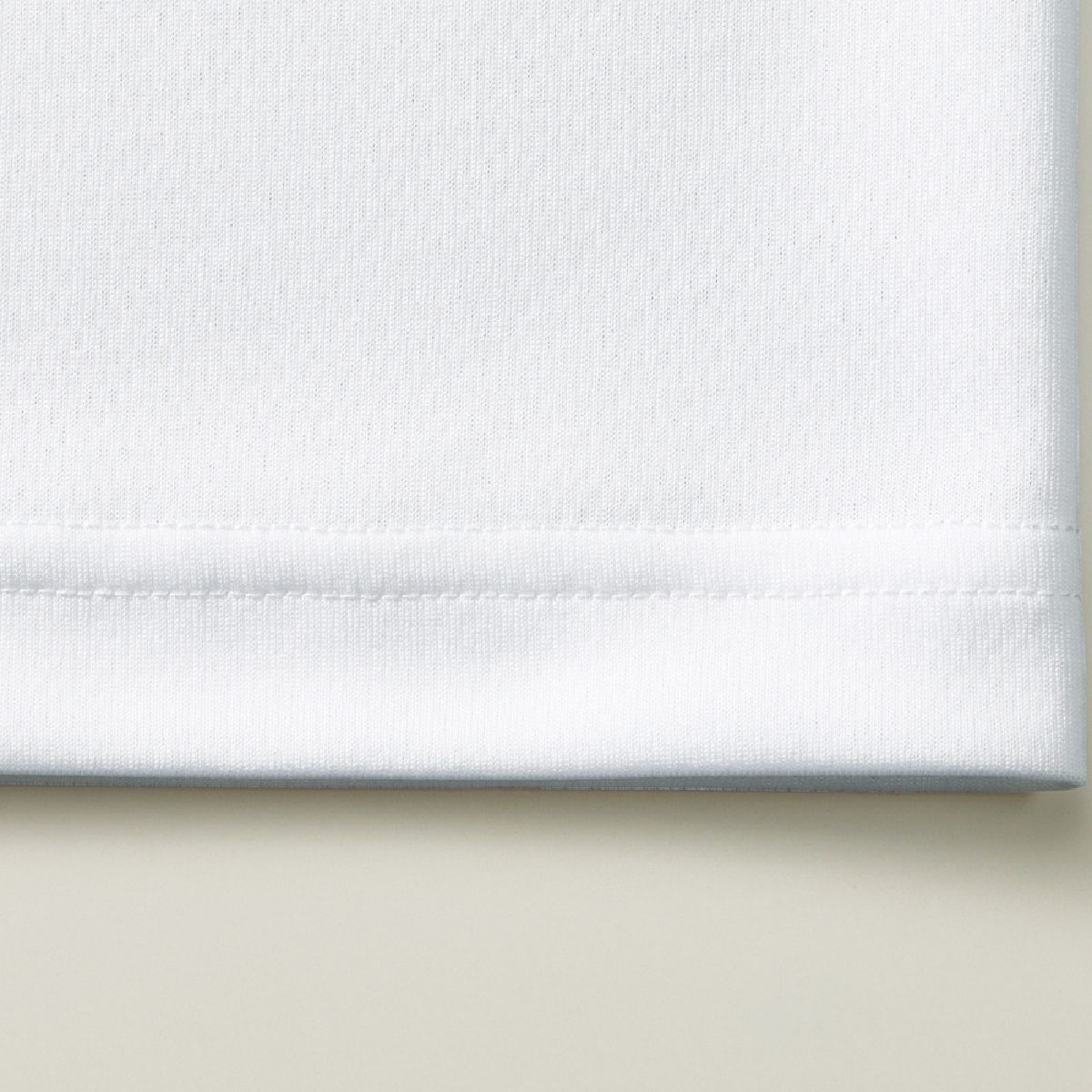 The hem is finished with a double needle stitch.