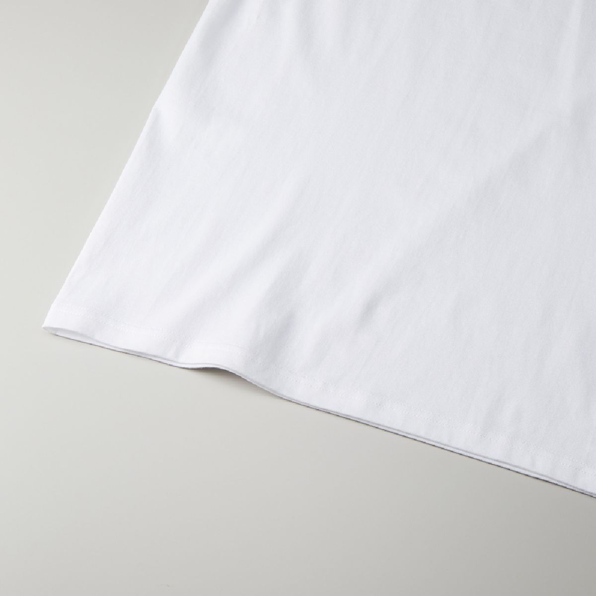 The hem is finished with a double needle stitch.