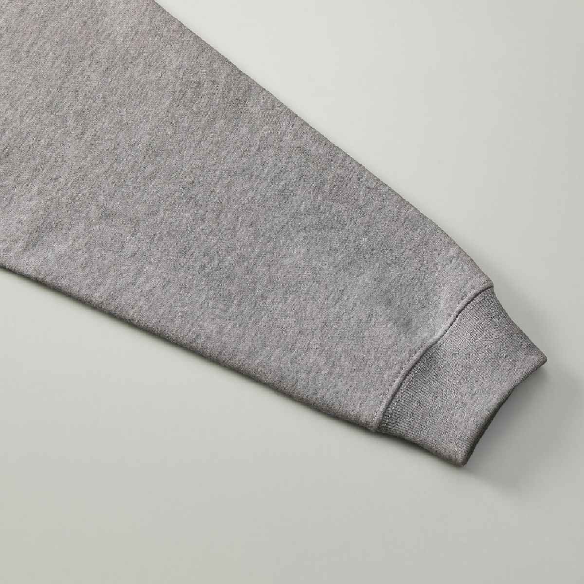 The ribbed cuffs and body seams are finished with robust double stitching.