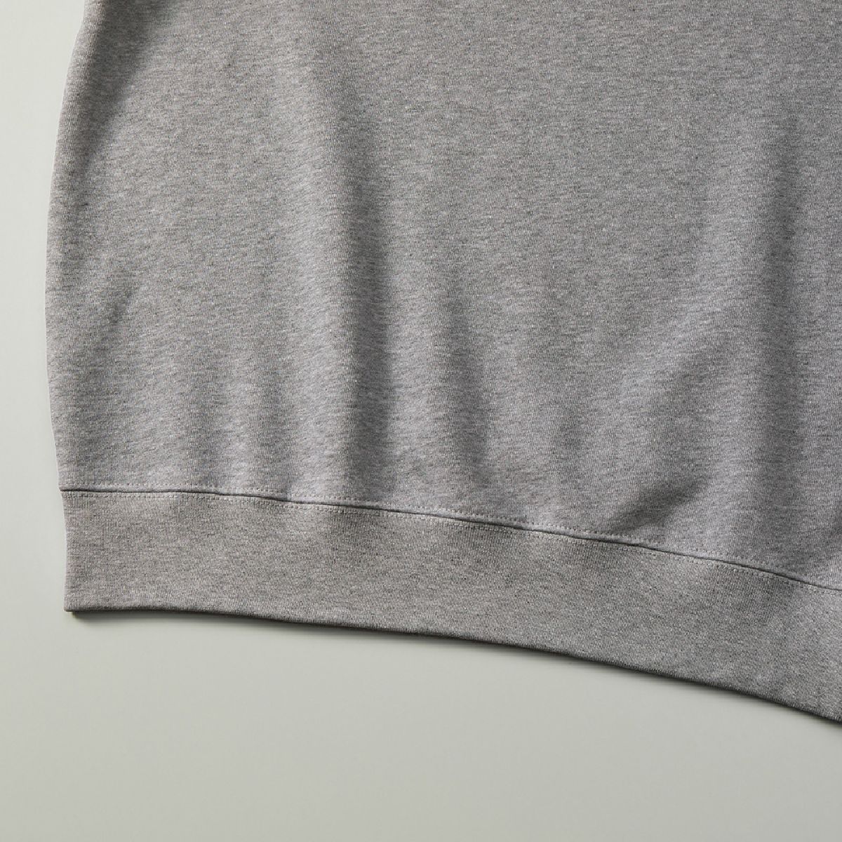 The ribbed cuffs and body seams are finished with sturdy double stitching.