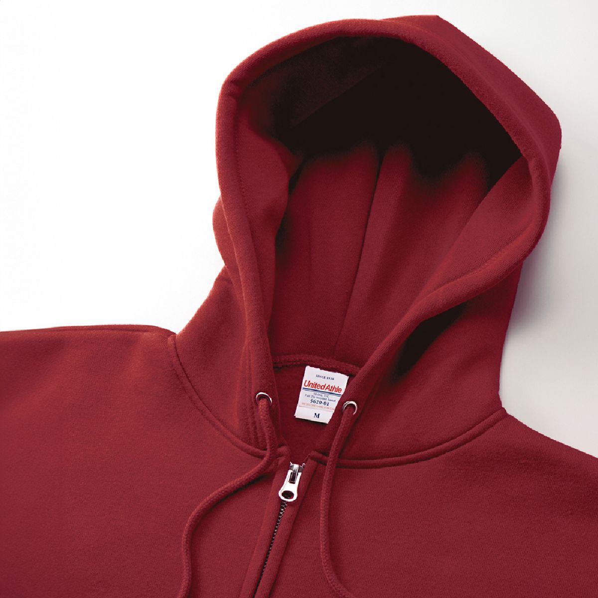 The zipper is concealed, features a single slider, and the hood drawstring is a round cord in the same color as the body.