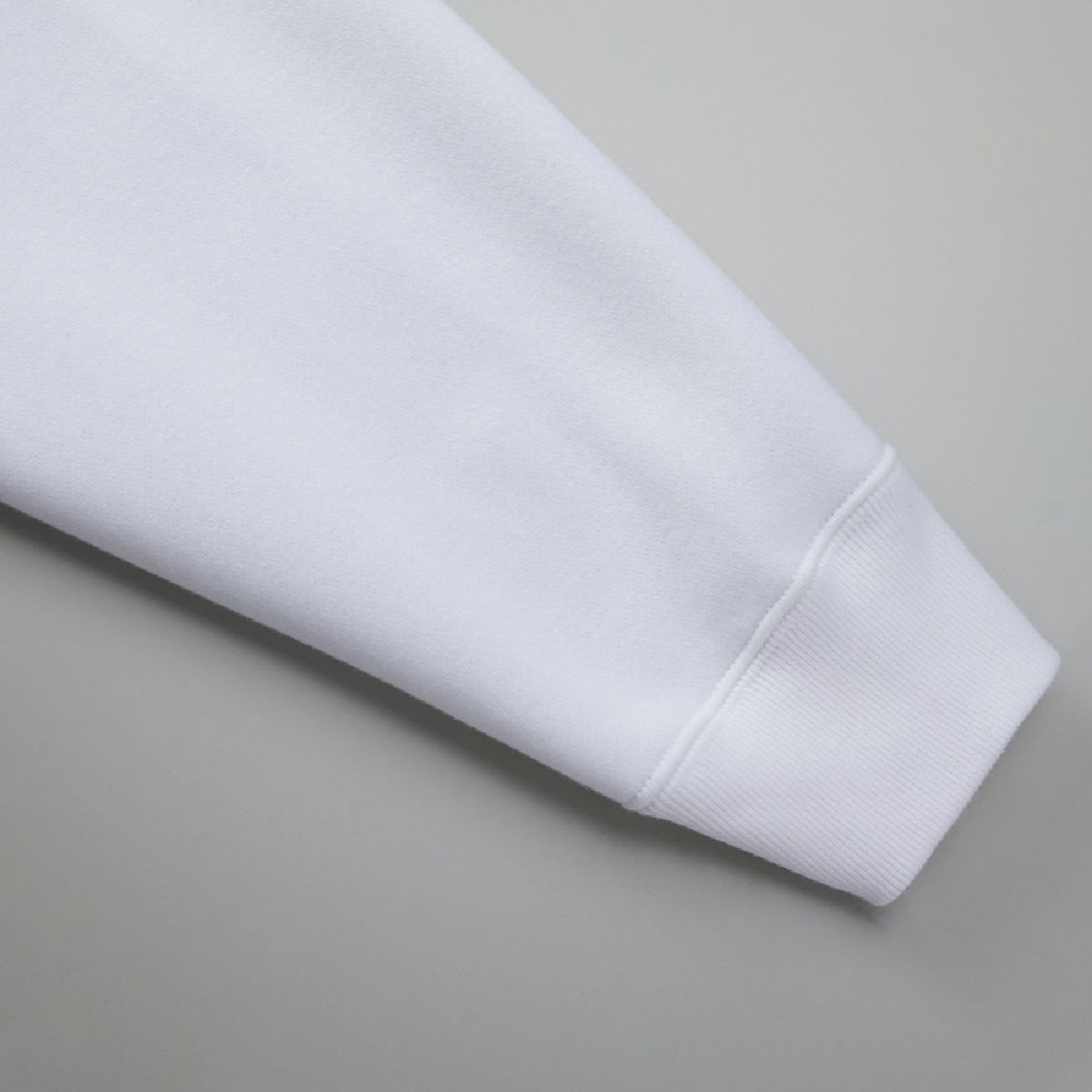 The seams between the cuff body and ribbing are finished with durable double stitching.