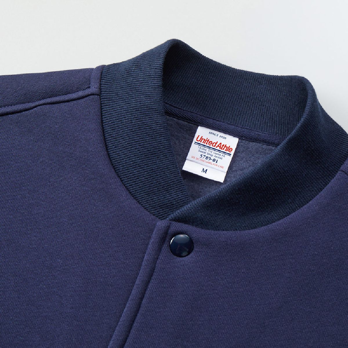 The collar has a ribbed neckline.