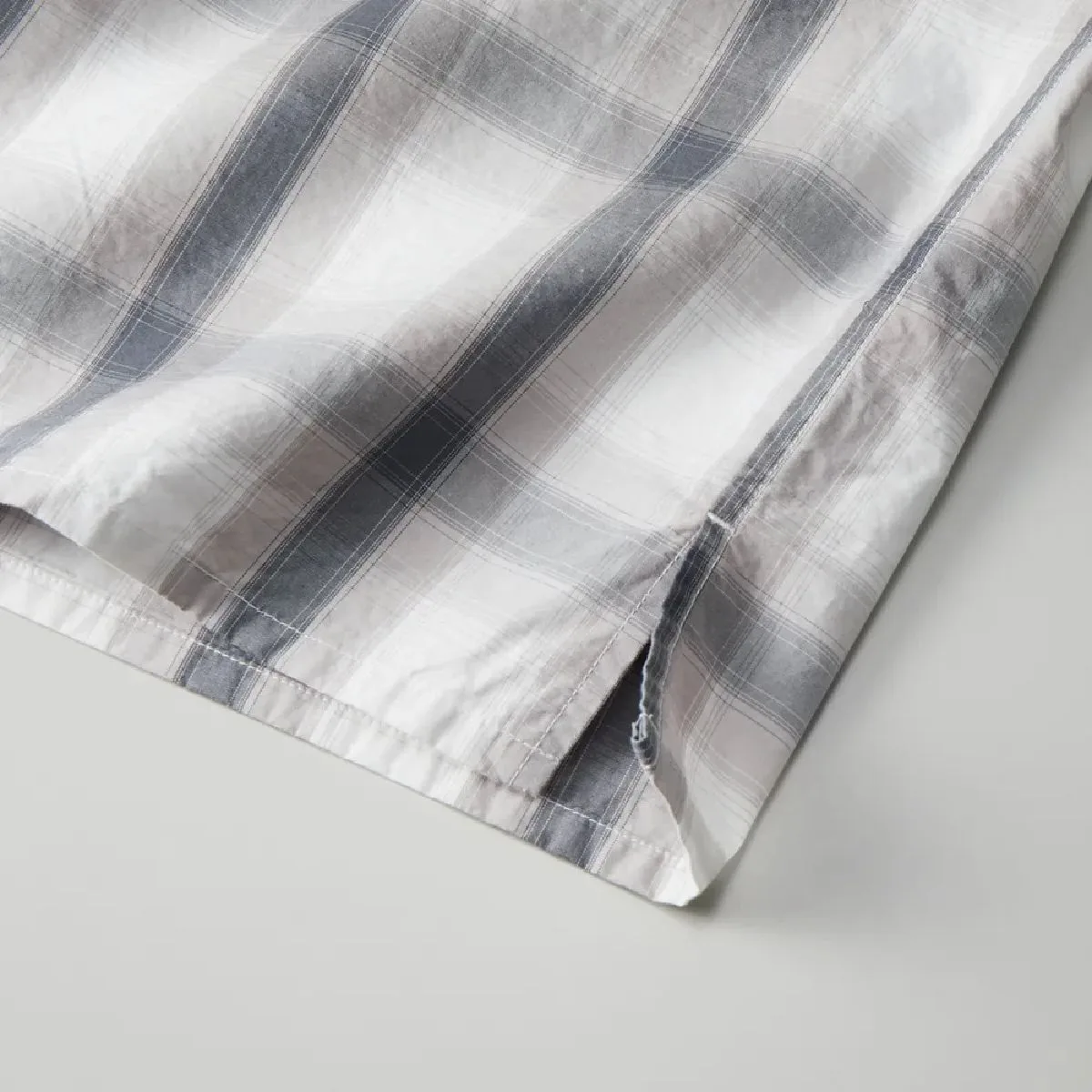There are slits on both sides of the hem.