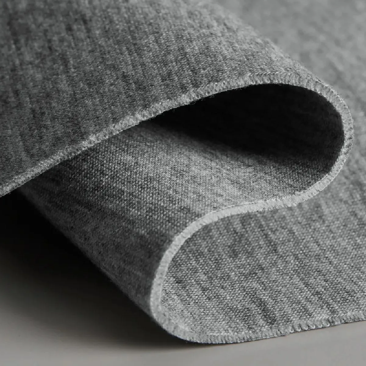 A multi-layered corrugated knit fabric made by joining two pieces of fabric together with a middle thread (cross-section view).