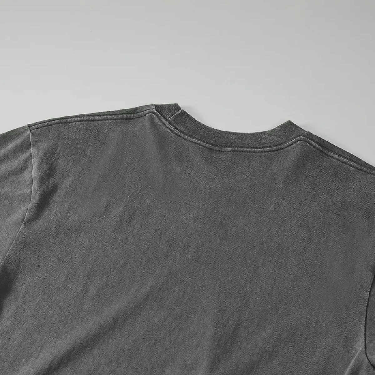 The wear and puckering along the seams create a vintage feel.