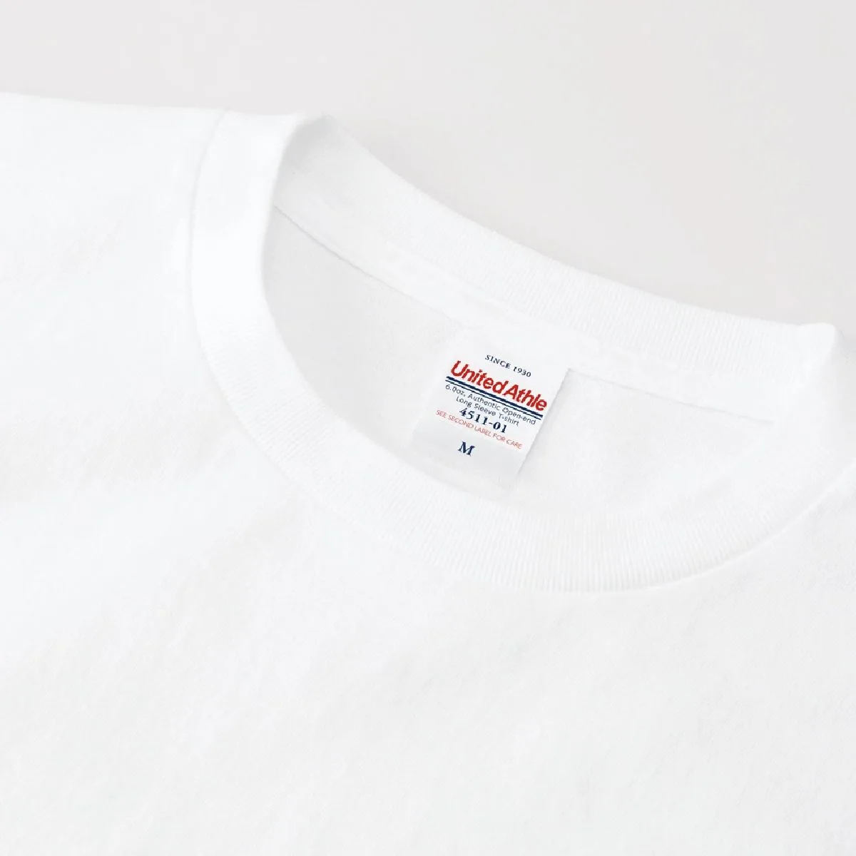 The neck ribbing features a minimalist, stitch-free design.