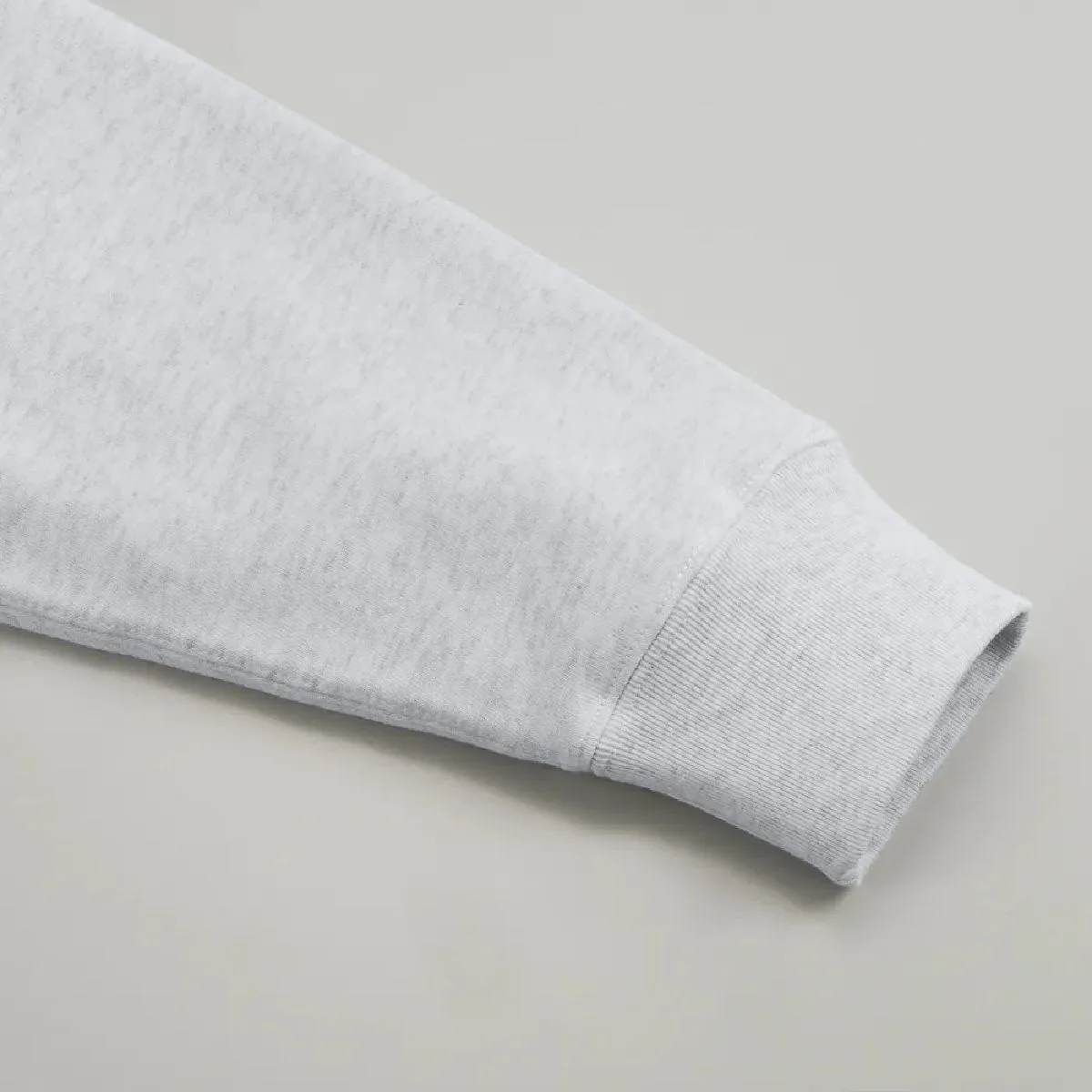 The cuffs are ribbed, and the seams are finished with a robust double-needle stitching.