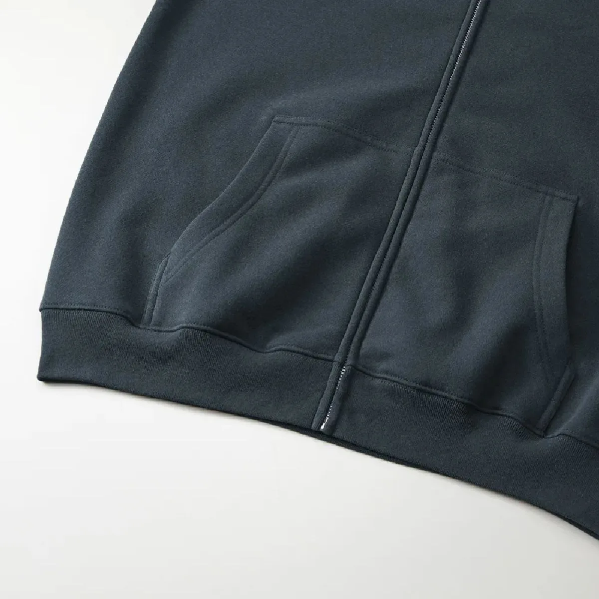Features a large kangaroo pocket, and the ribbed cuffs and body seams are finished with a sturdy double-needle stitching.