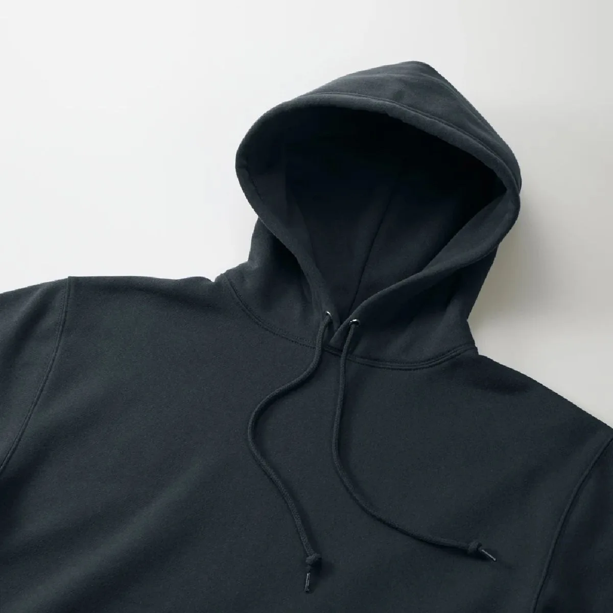 It features a double hood with a three-dimensional design.