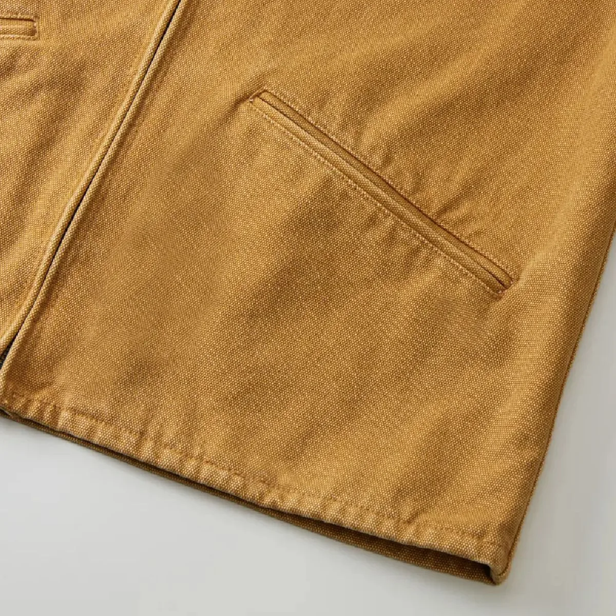 The side pockets feature a clean, durable double-welt design.