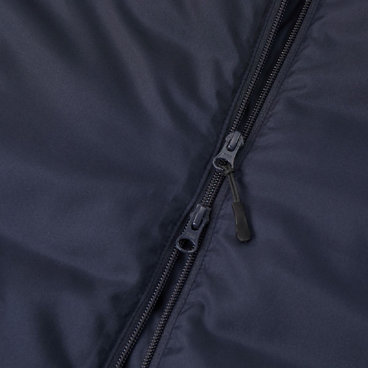 The zipper is a YKK DALH type double slider with a zipper pull tab.