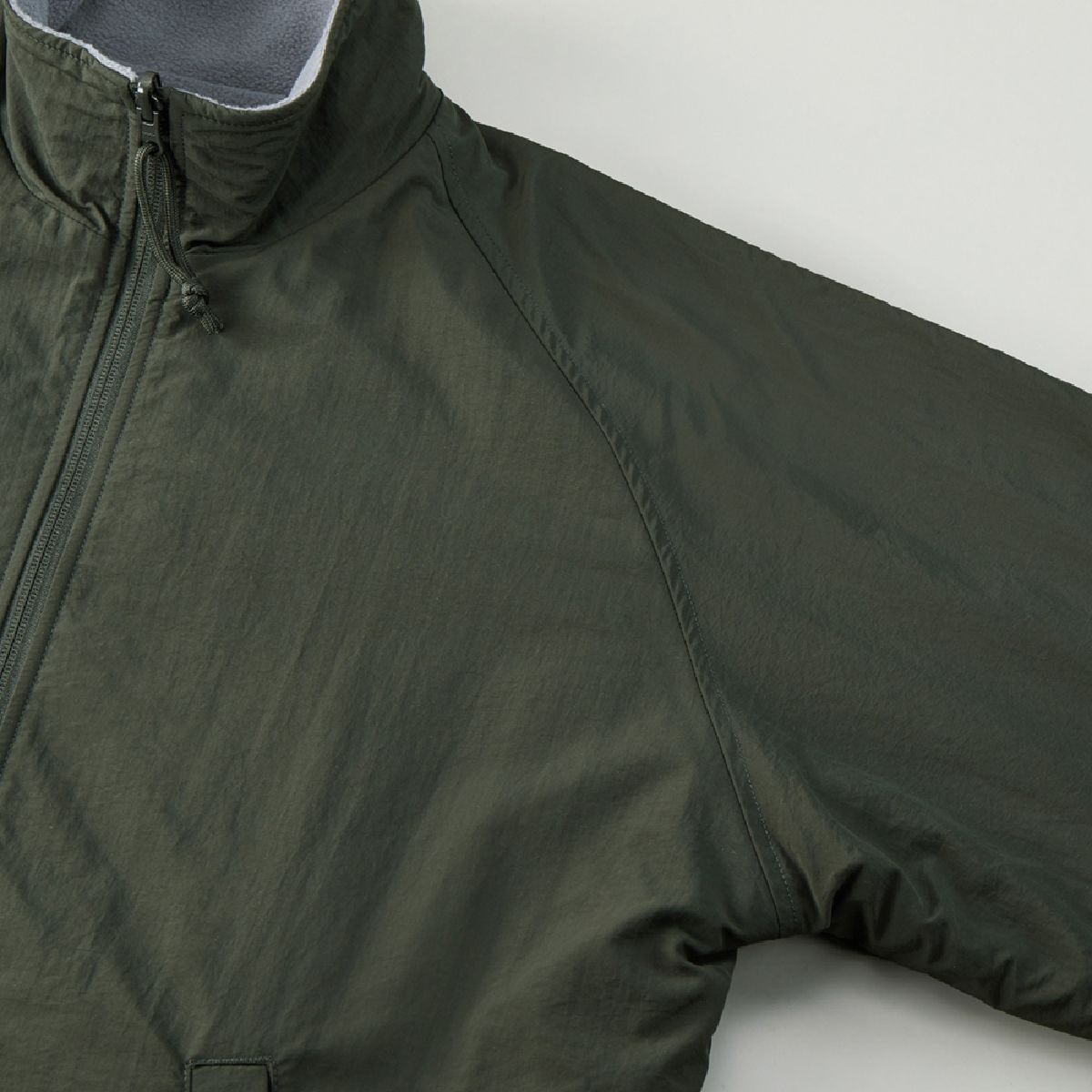 The sleeves are attached in a raglan style.