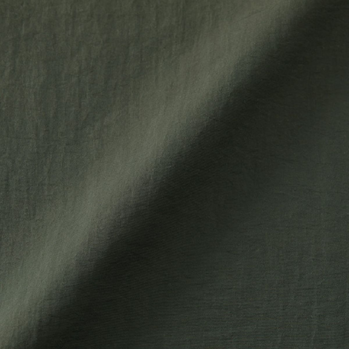 A fabric that feels like cotton despite being 100% nylon (nylon side).